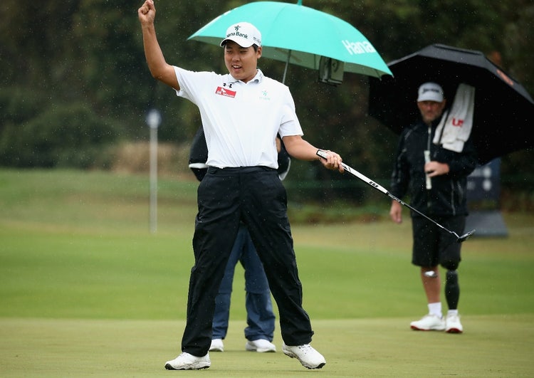 A person holding a golf club AI-generated content may be incorrect.