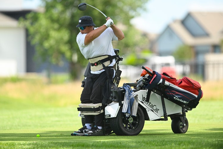 A person playing golf on a golf cart AI-generated content may be incorrect.