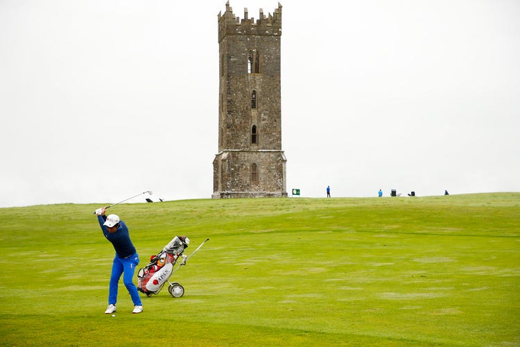 A person swinging a golf club AI-generated content may be incorrect.
